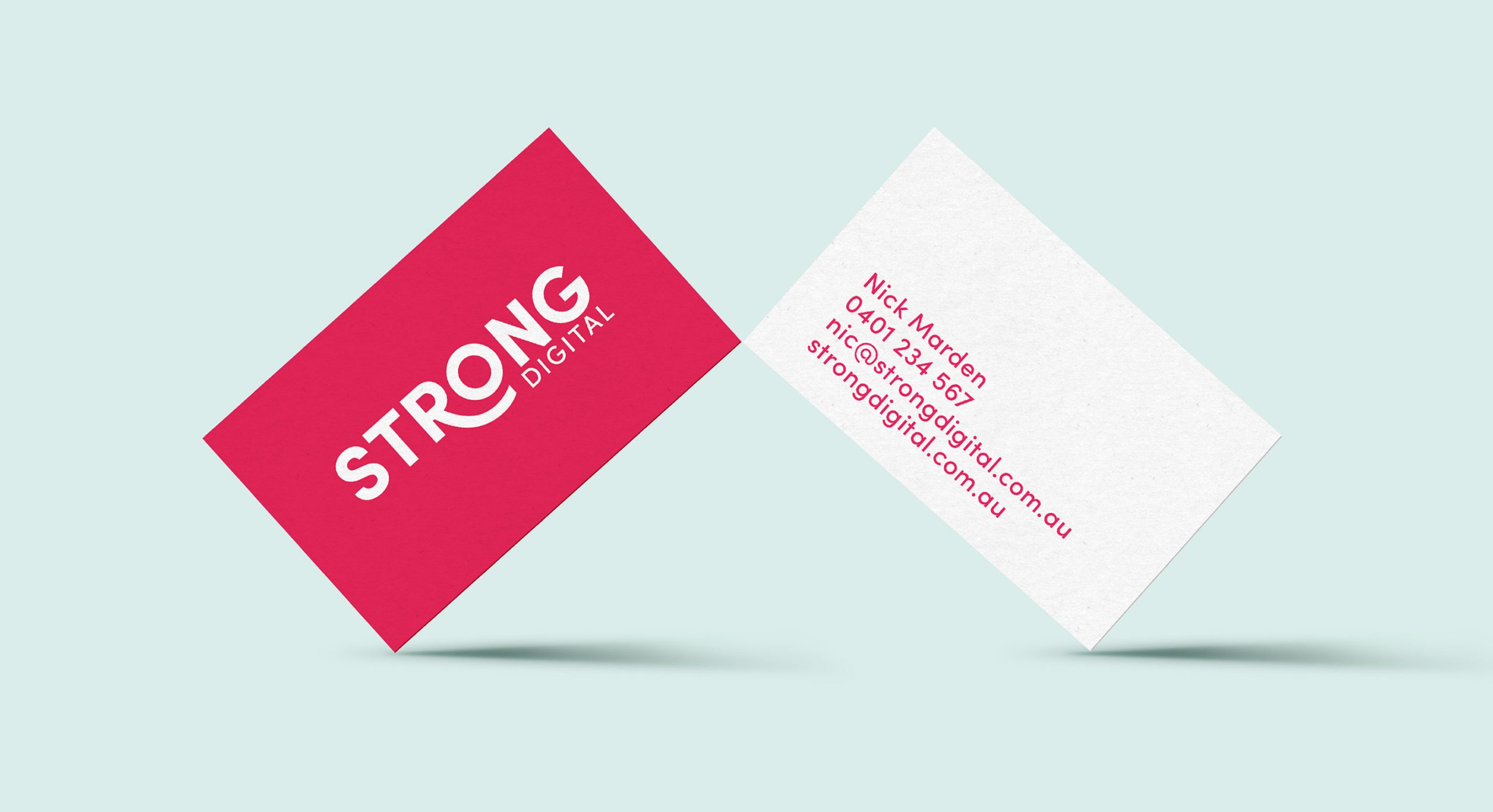 business cards for strong digital team members showing bright prink highligh colour from brand palette