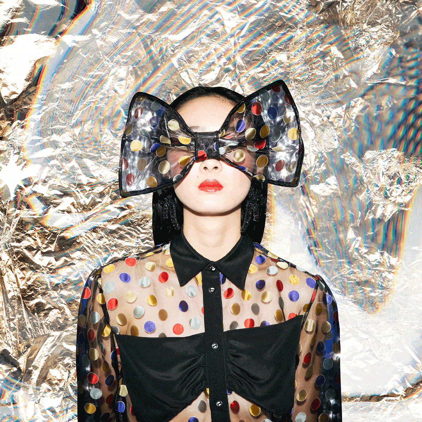 glitch artwork of woman in bold spotted dress and bow headpiece over her eyes