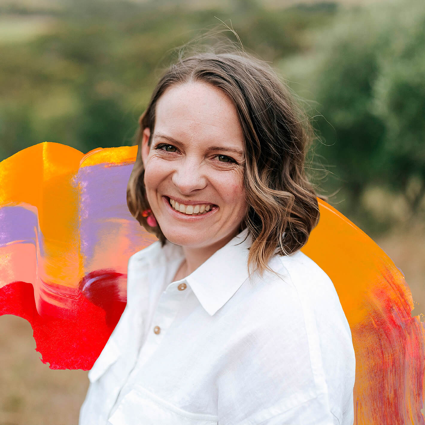 Copywriter Anna Rogan stands in front of a paint texture created for her custom australiana inspired brand identity