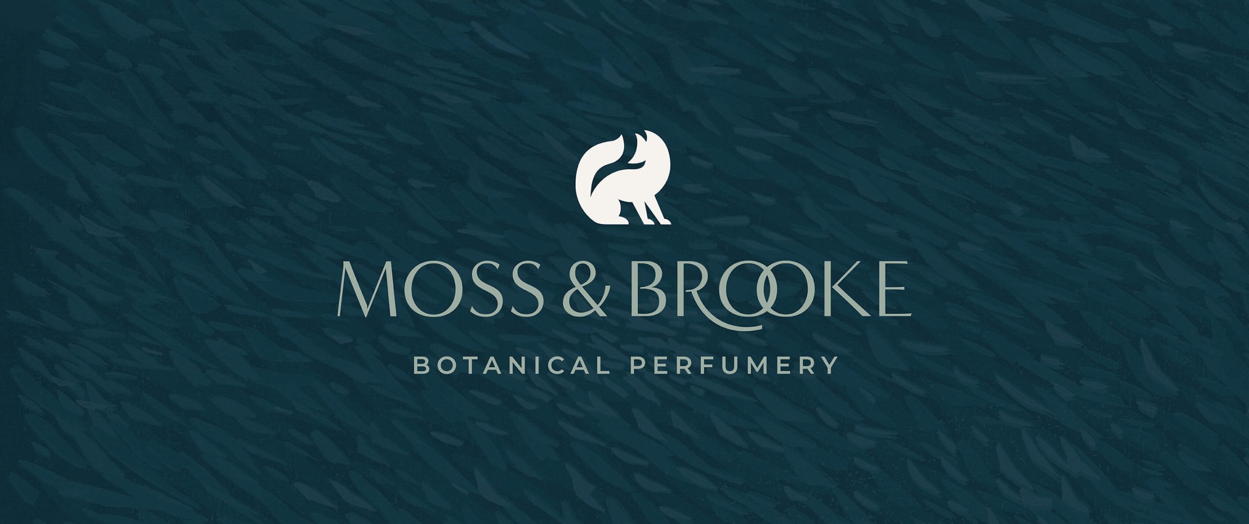 Moss and Brooke custom logo design and fox logo icon over a lush green forest inspired linoprint texture background