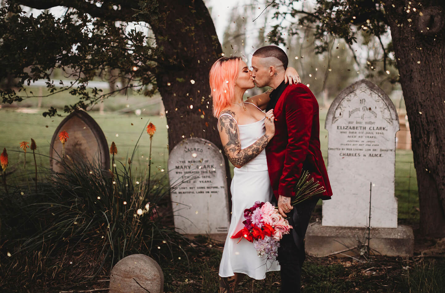 Brand design portfolio banner featuring brand photography for Eco Confetti. A punk-styled couple kiss in a graveyard, gold glitter-y confetti surrounding them.